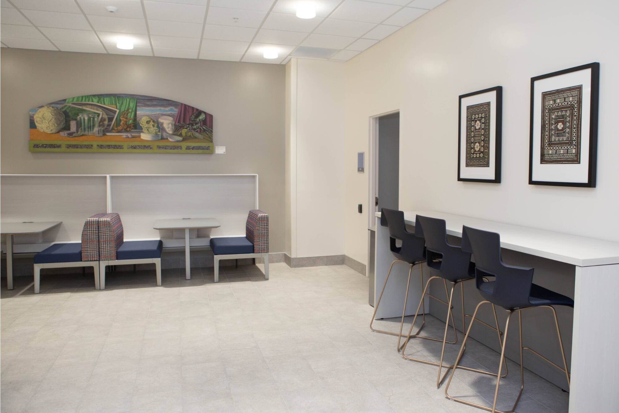 Photograph of a study area in Finkelstein Hall that shows artwork on display.